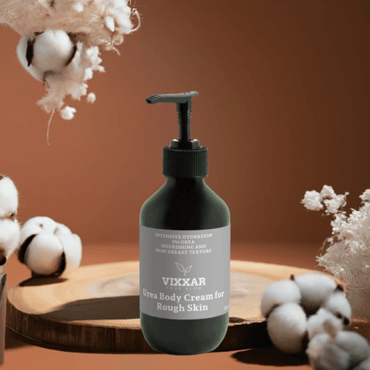 Vixxar Urea Body Cream 280ml bottle for intense hydration of dry and sensitive skin, surrounded by cotton on a wooden tray.