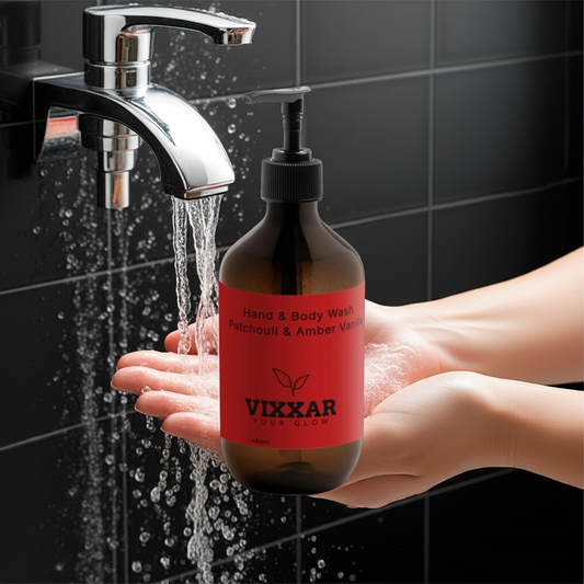 Hands using Vixxar Patchouli & Amber Vanilla Hand & Body Wash, 490ml, beside running water, promoting a luxurious vegan cleanse.