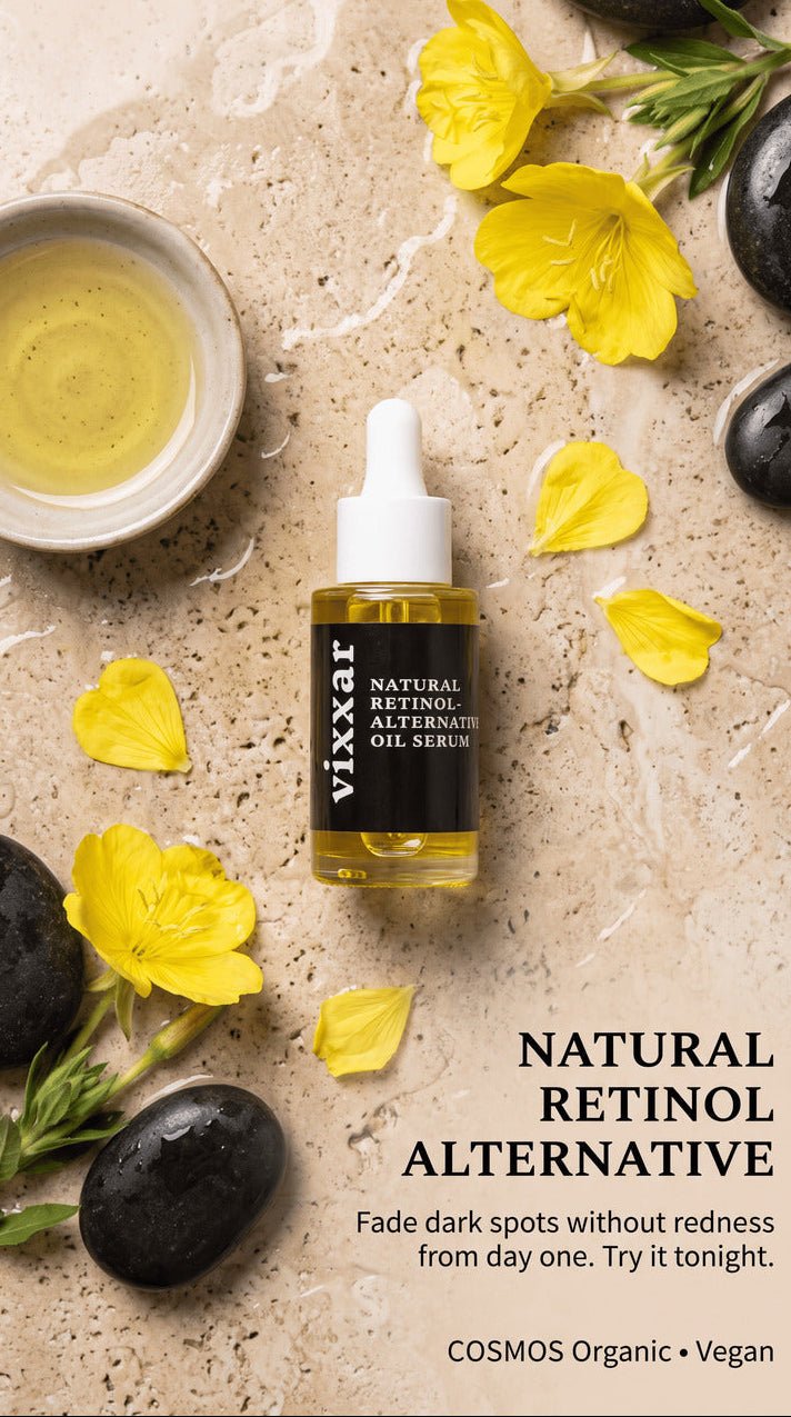 Vixxar Natural Retinol Alternative oil serum in a clear dropper bottle, styled on a beige stone surface with yellow flowers, black stones, and a small bowl of oil.