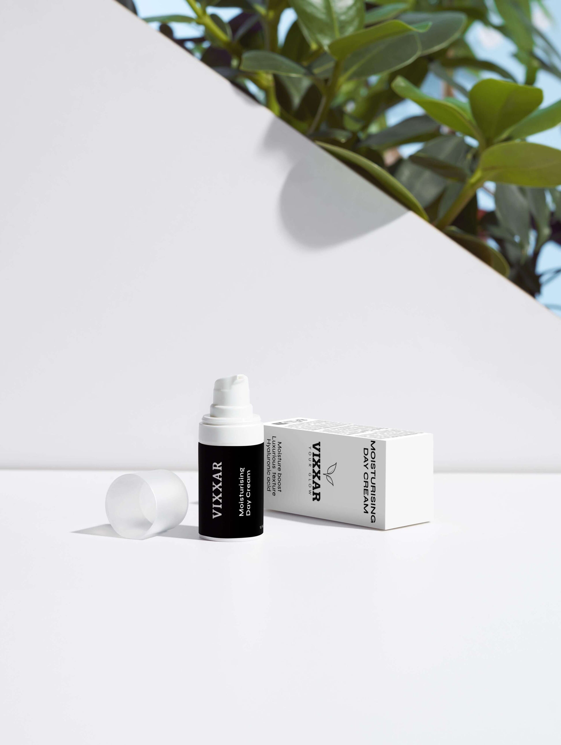 Vixxar skincare serum bottle and packaging with plants in background, promoting radiant, hydrating, and vegan beauty care.