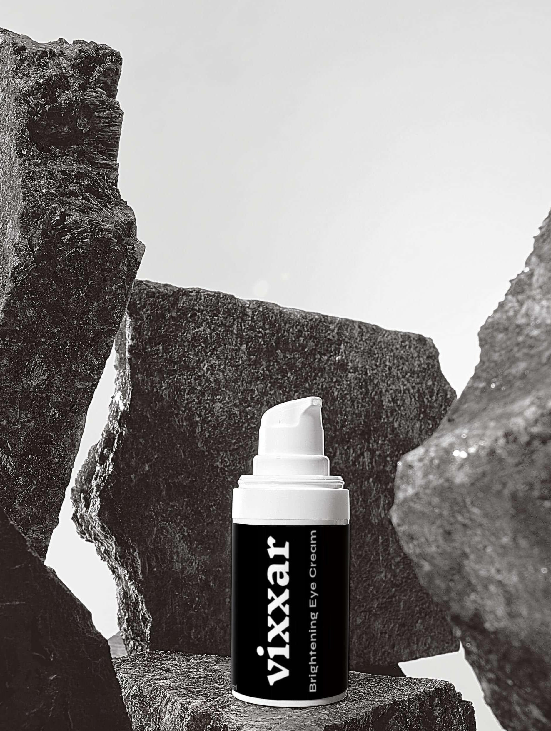 Vixxar Brightening Eye Cream on rocky surface, enhancing hydration and radiance for a youthful glow.