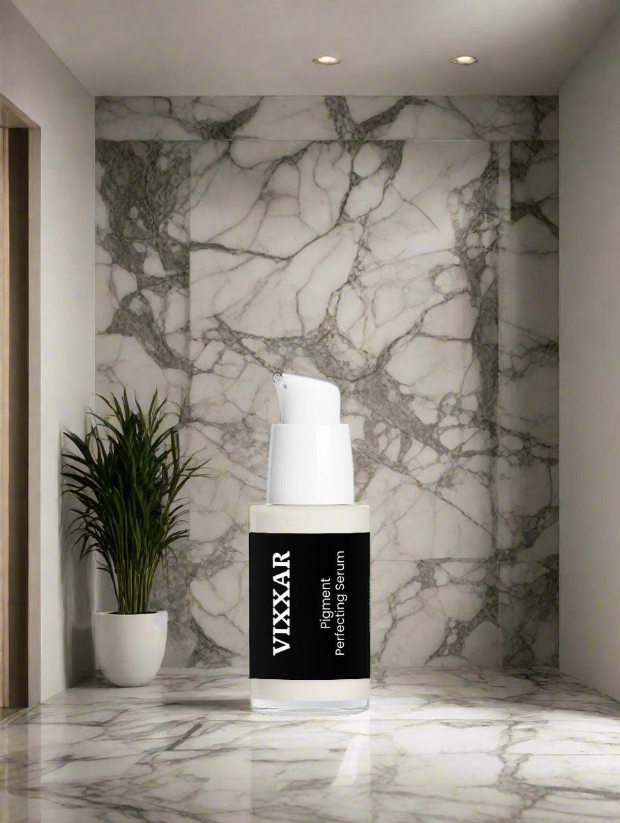 Vixxar Pigment Perfecting Serum 30ml in a modern marble bathroom setting, featuring skincare benefits and brightening properties.