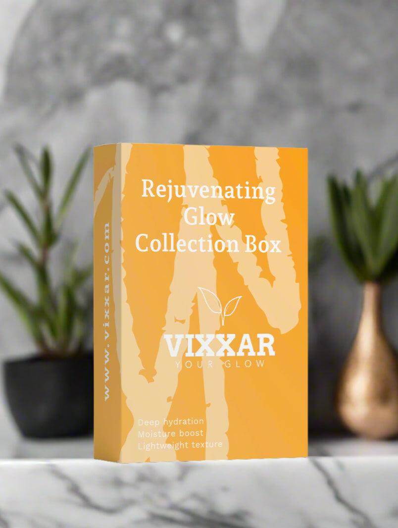 Rejuvenating Glow Collection Box by Vixxar on a marble table, luxurious skincare set for firm and bright skin. Vegan Cleanser included.