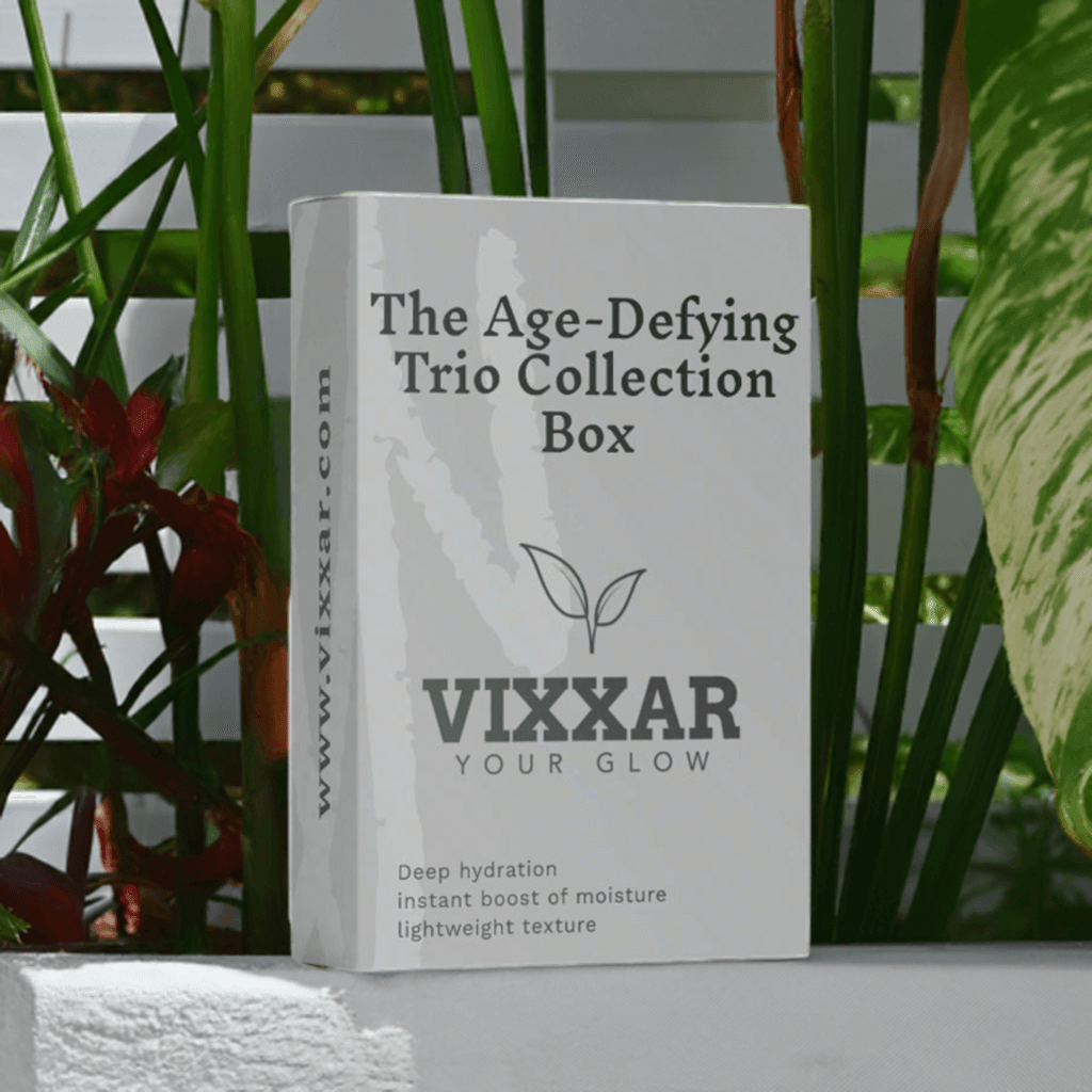 Age-Defying Trio Collection Box by Vixxar with deep hydration, peptide serum, and anti-aging skincare features in garden setting.