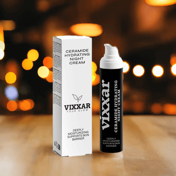 Vixxar Ceramide Hydrating Night Cream 50ml for dry aging skin with box and bottle on wooden table, background lights.