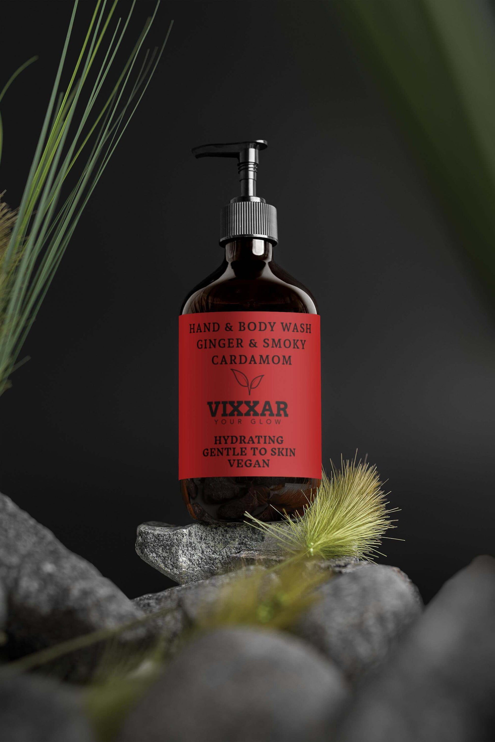 Ginger body wash in a 490ml bottle with smoky cardamom scent, displayed on rocks.