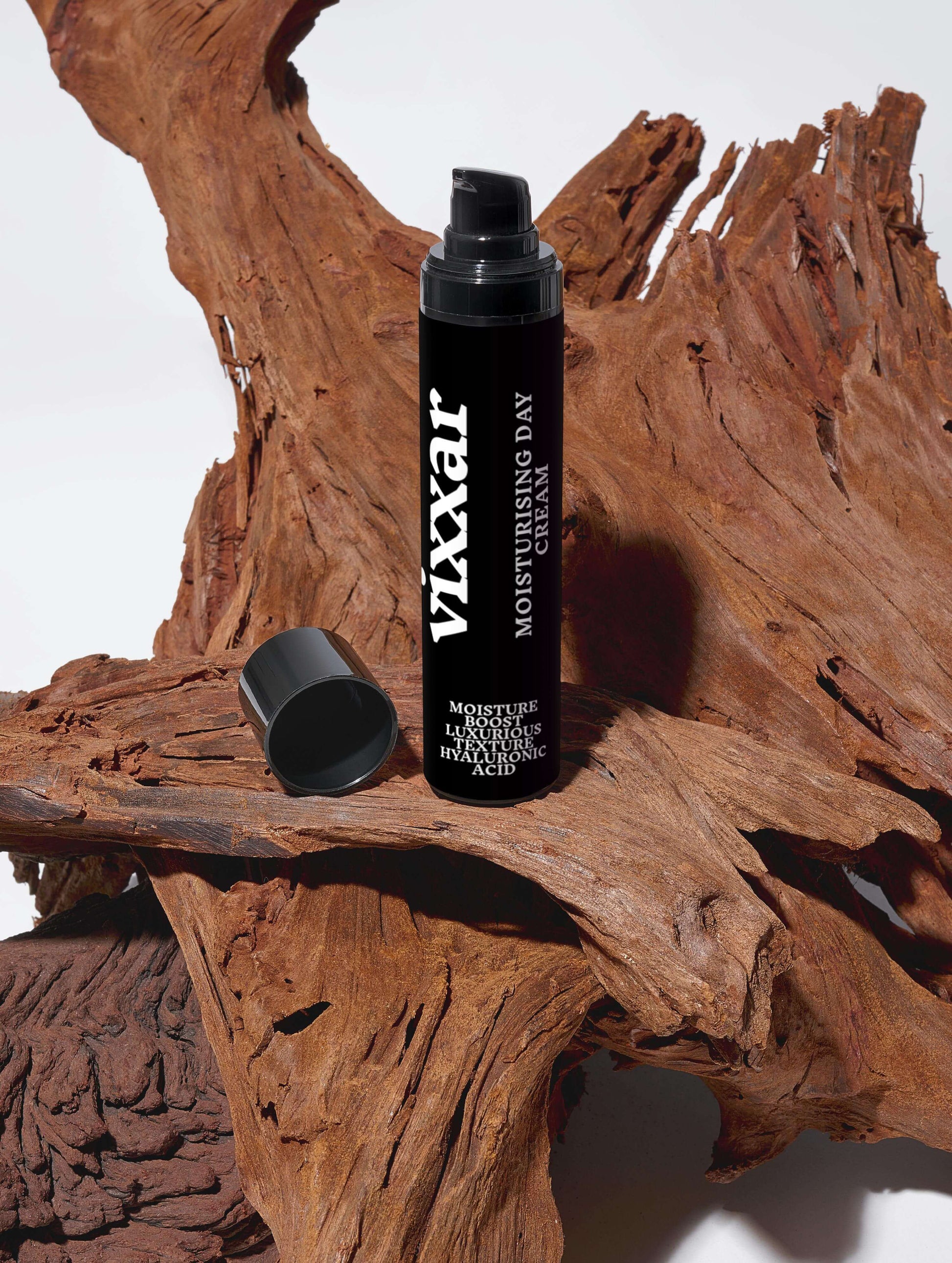 Moisturizing Day Cream 50ml bottle on rustic wood, offering silky hydration with hyaluronic acid for dewy, radiant skin.