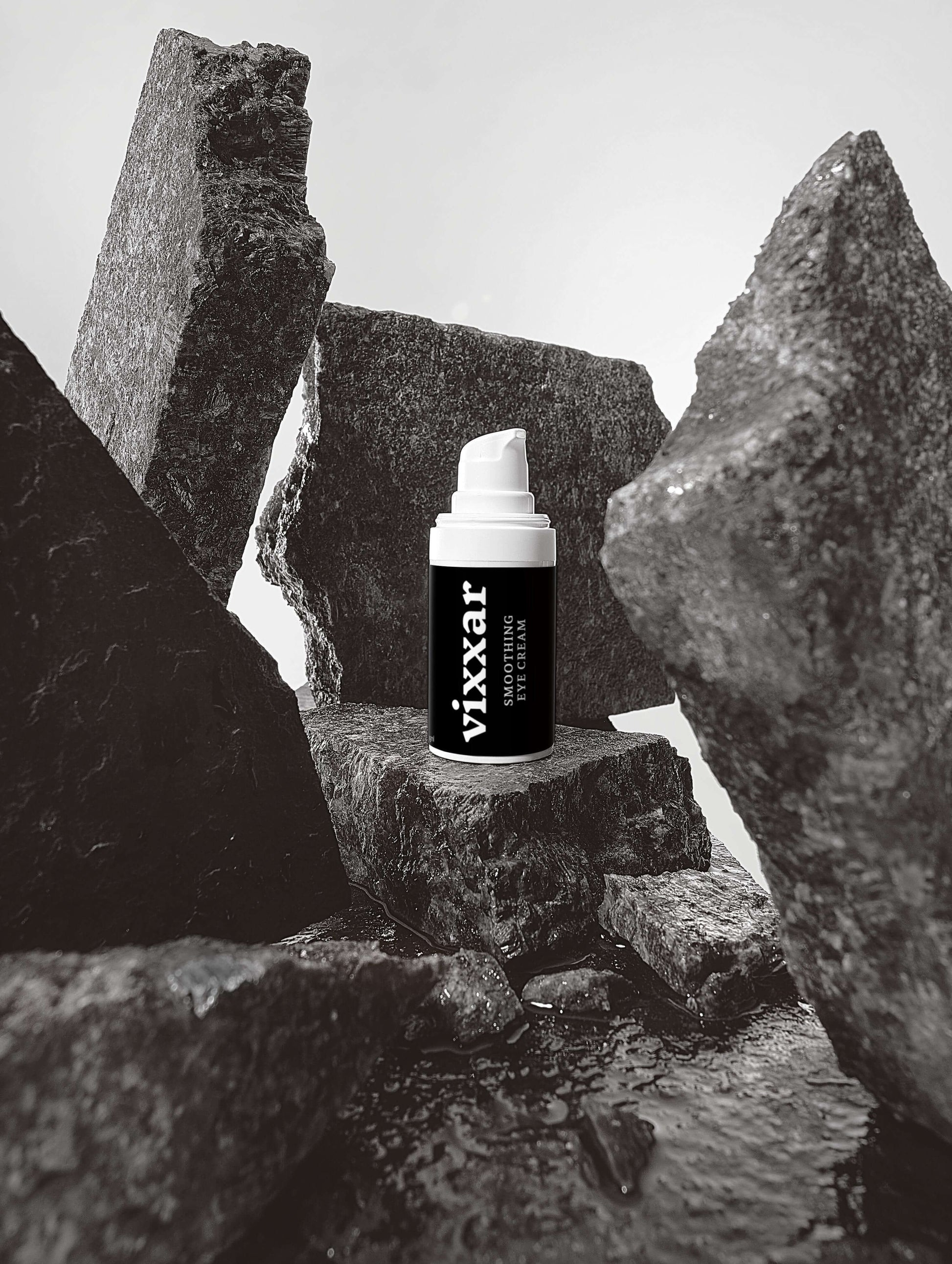 Smooth Hydrating Eye Cream 15ml bottle amid rocks, highlighting hydrate eye cream benefits for brightening and puffiness relief.