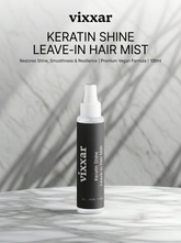 Vixxar Keratin Shine Leave-In Hair Mist bottle on a marble surface with a gray background