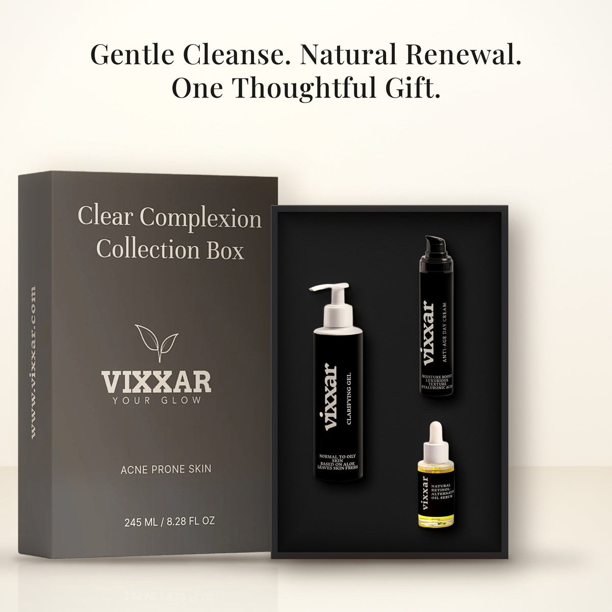 Open Vixxar Clear Complexion Collection Box: black inner box holding Clarifying Aloe Vera Gel Cleanser, Anti-Age Day Cream and Natural Retinol Alternative Oil Serum beside the sleeve