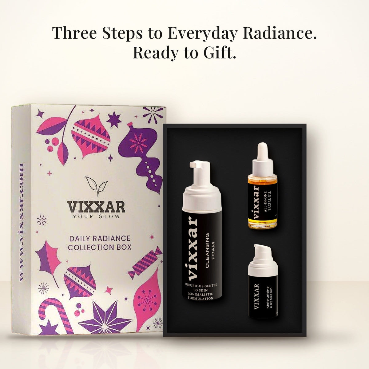 Open Vixxar Daily Radiance Collection Box: black inner box holding Cleansing Foam, All-In-One Facial Oil and Moisturising Day Cream beside the sleeve