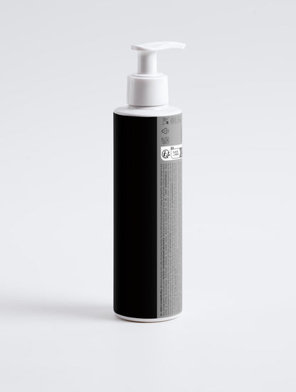 Back view of Vixxar Gentle Cleansing Milk pump bottle showing product information label and white dispenser