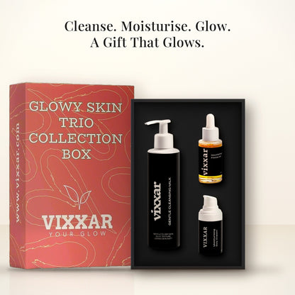 Open Vixxar Glowy Skin Trio Collection Box: black inner box holding Gentle Cleansing Milk, Nourishing Facial Oil and Moisturising Day Cream beside the sleeve