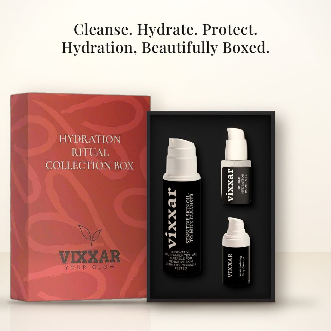 Open Vixxar Hydration Ritual Collection Box: black inner box holding Oil-To-Milk Cleanser, Double Hydration Boost Gel and Moisturising Day Cream beside the sleeve