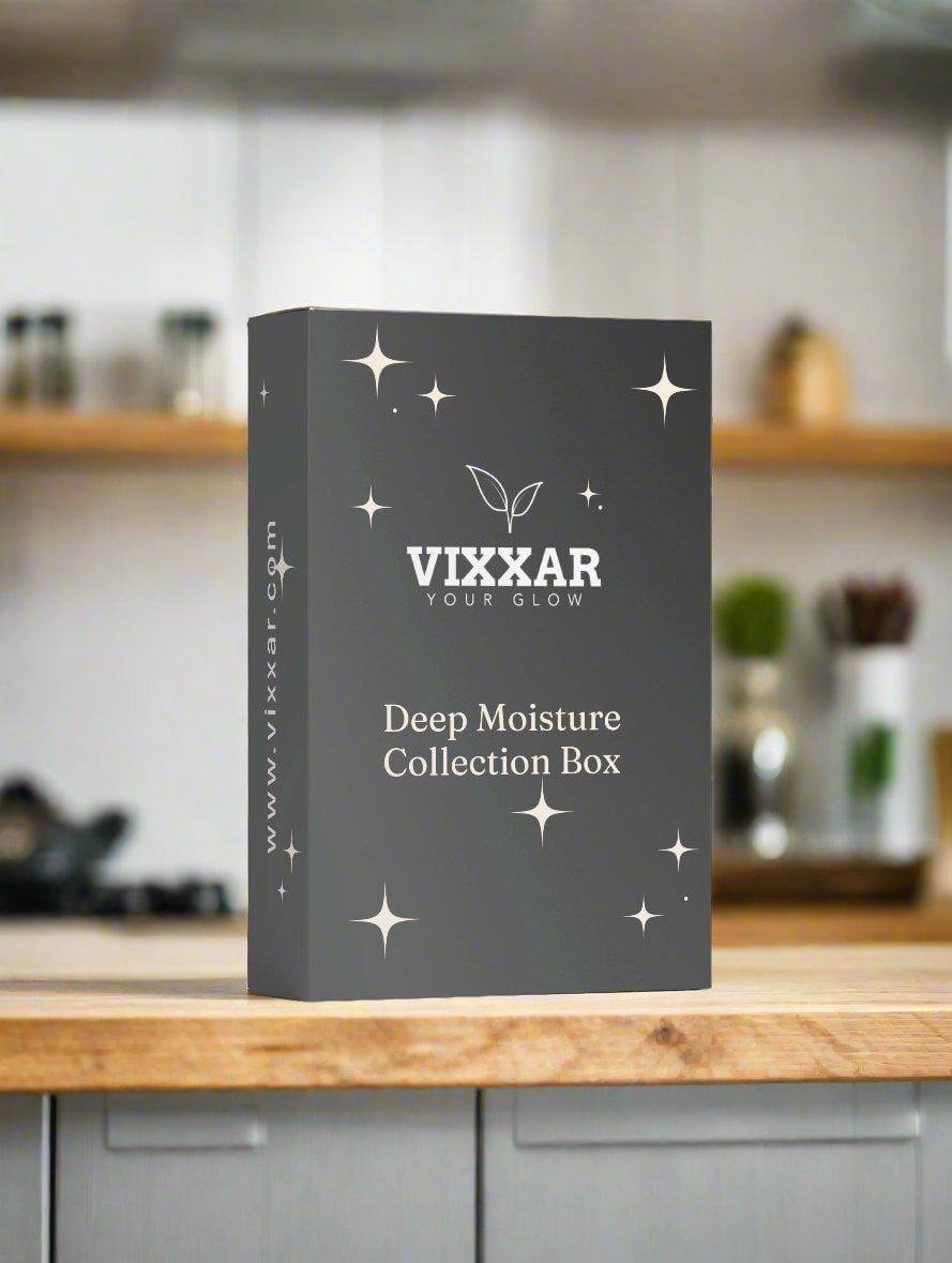 Vixxar Deep Moisture Collection Box on kitchen countertop, featuring vegan cleanser, hydrating cream, and eye brightener for skincare