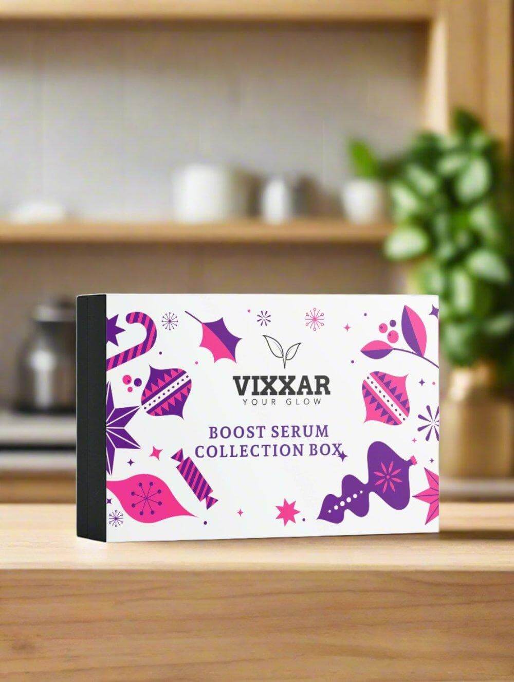 Vixxar Boost Serum Collection Box displayed on a wooden table, ideal for enhancing skincare routine with vegan, hydrating serums.