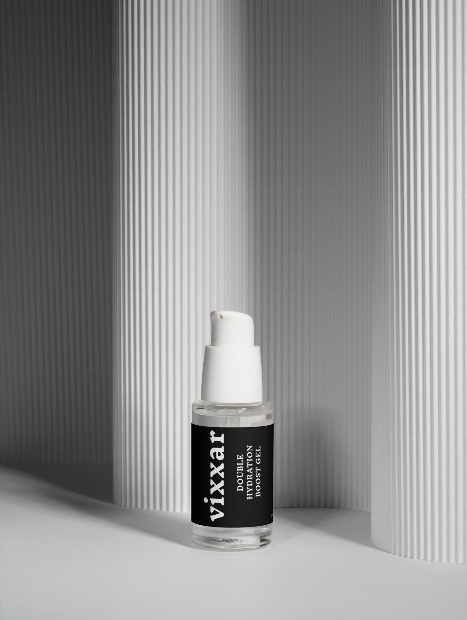 Skincare serum bottle with black label on a neutral background