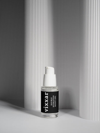 Skincare serum bottle with black label on a neutral background